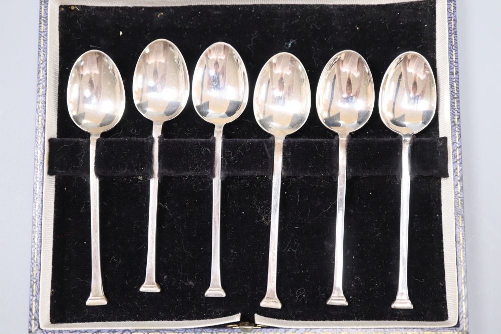 A set of six 1970s silver gilt fox head terminal coffee spoons, 77 grams and a plated set of coffee spoons.